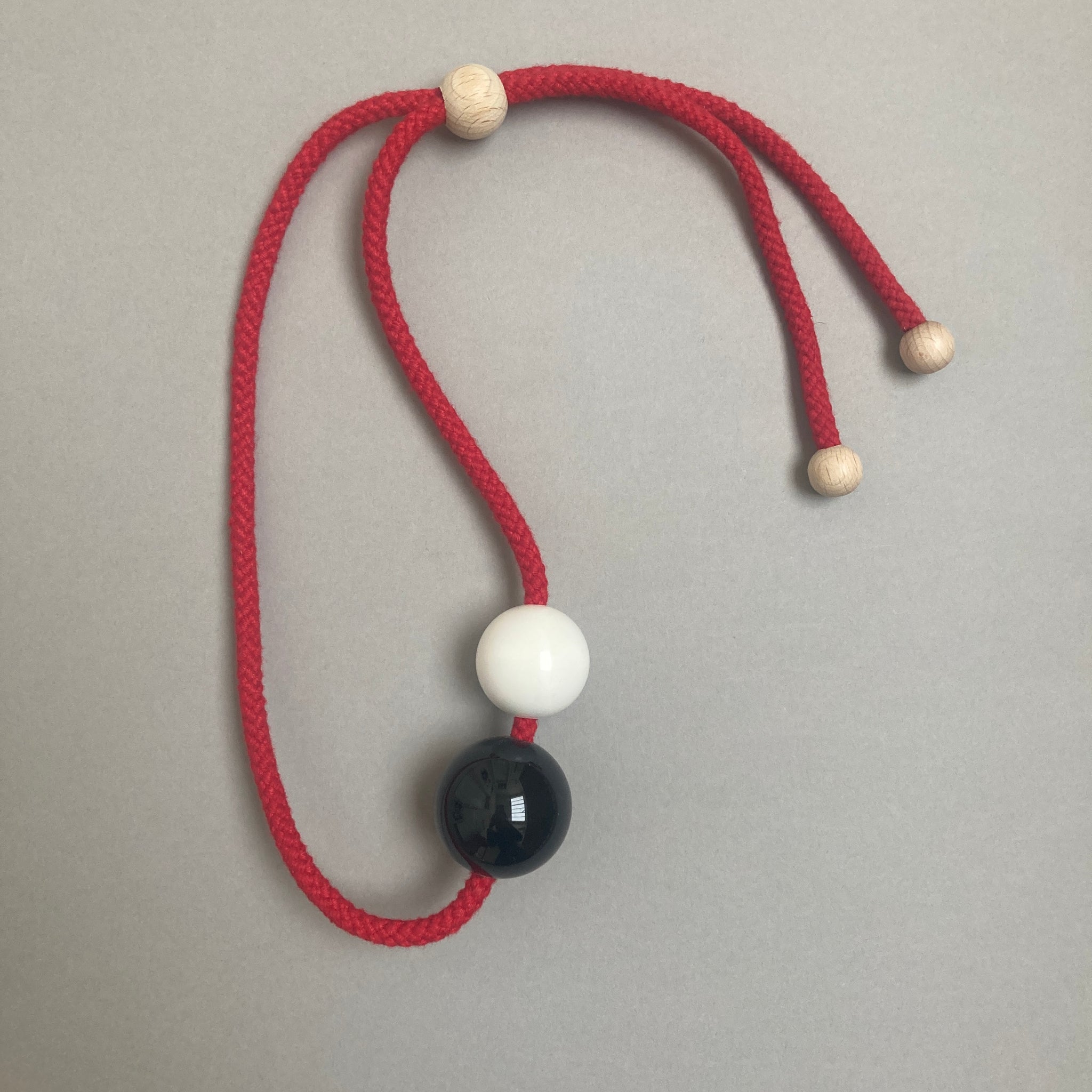 Sample necklace on red cord